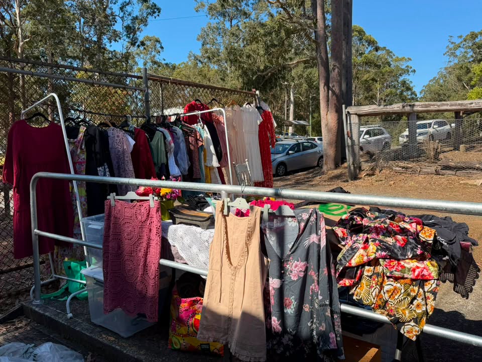 Clothes on a rack at a stall